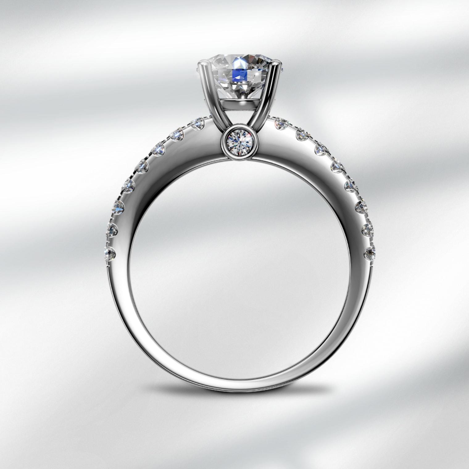 Inel de logodna, aur alb, 18K, diamant central rotund 0.4ct si diamante laterale de 0.23ct -TEILOR